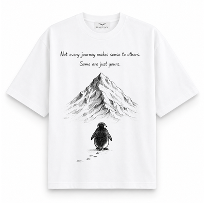 RAVYNN Oversized White T-Shirt – "Not Every Journey" Penguin & Mountain Graphic