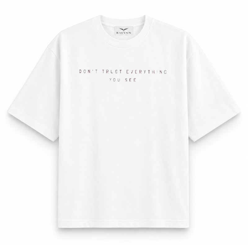 RAVYNN Oversized White T-Shirt – "Realistic / Don't Trust Everything You See" Sculpture Back Graphic