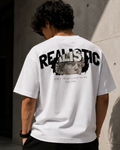 RAVYNN Oversized White T-Shirt – "Realistic / Don't Trust Everything You See" Sculpture Back Graphic