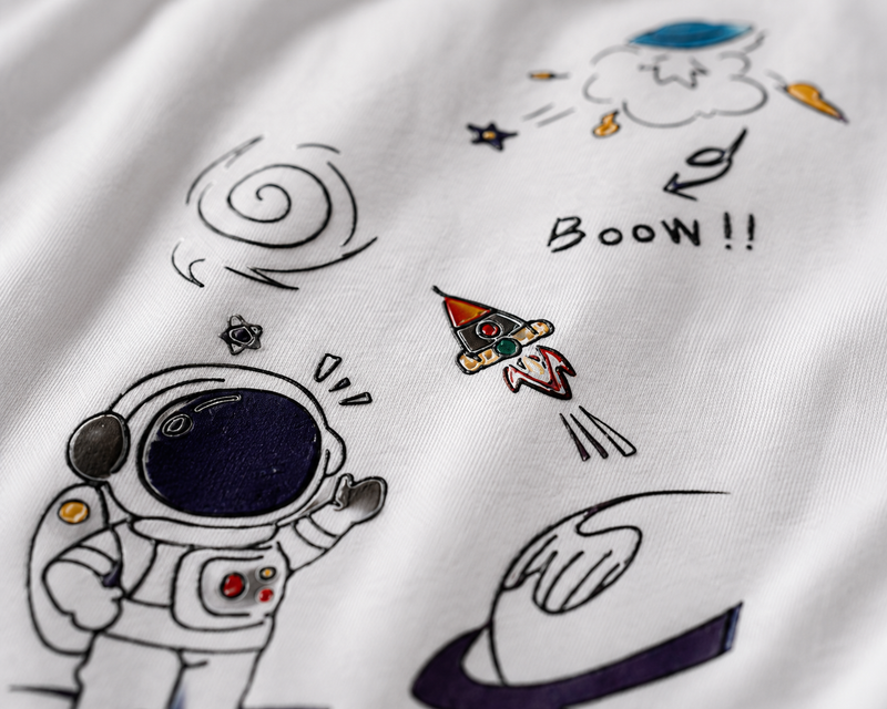 RAVYNN Oversized White T-Shirt – Doodle Astronaut & Space Rocket Graphic