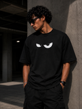 RAVYNN Oversized Black T-Shirt – White Angry Cartoon Eyes Graphic
